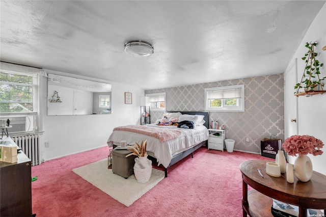 bedroom with carpet flooring and radiator heating unit