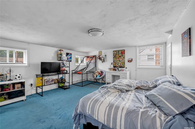 carpeted bedroom featuring a textured ceiling