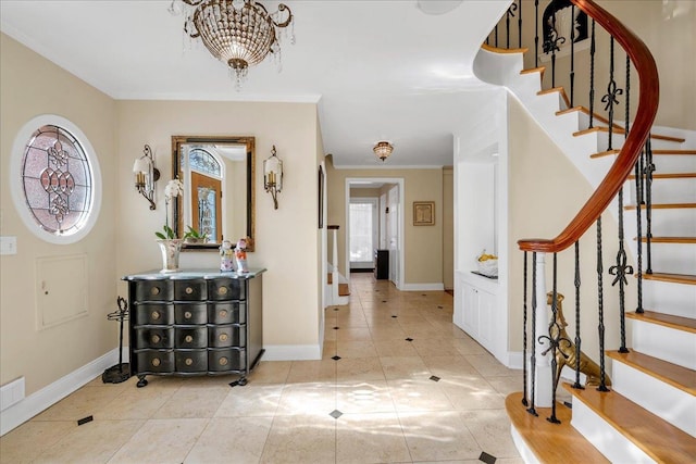 entryway featuring light tile patterned flooring, crown molding, and a notable chandelier