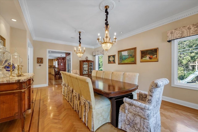 dining space with an inviting chandelier, ornamental molding, and light parquet floors