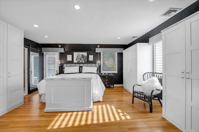 bedroom with light hardwood / wood-style floors