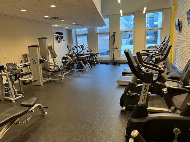 exercise room featuring a paneled ceiling