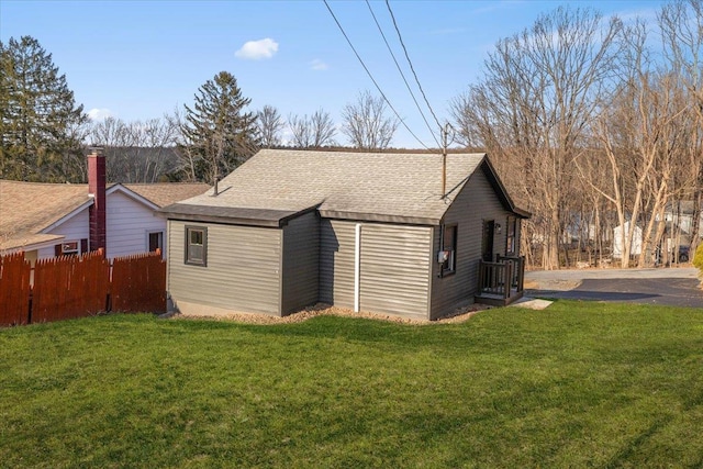 view of property exterior with a lawn