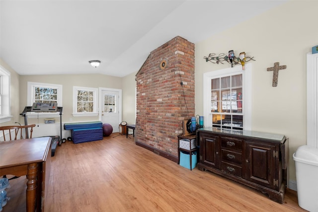 interior space featuring light hardwood / wood-style flooring and vaulted ceiling