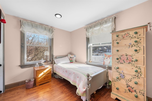 bedroom with wood-type flooring