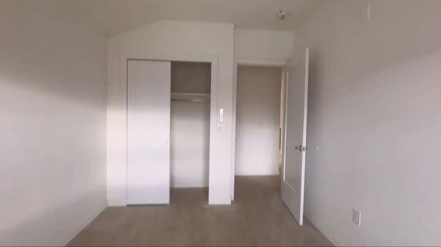 unfurnished bedroom featuring a closet