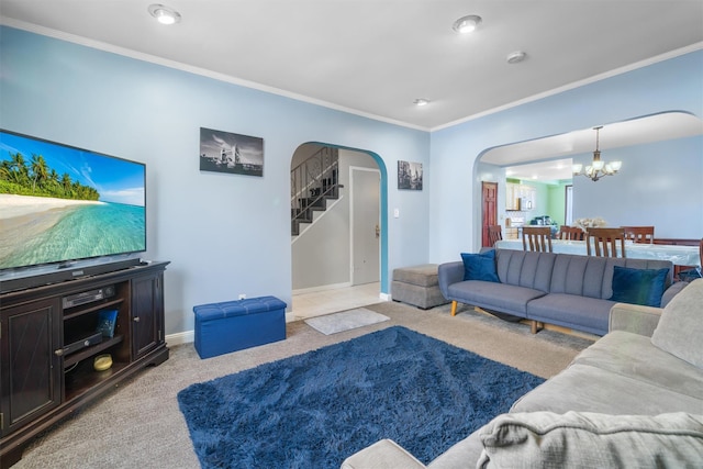 living room featuring crown molding, light colored carpet, and a chandelier