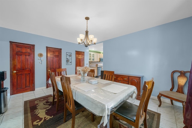 tiled dining area with a notable chandelier