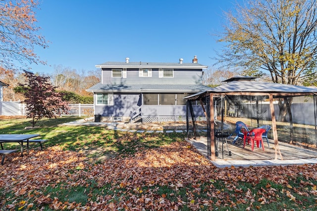 rear view of property with a gazebo