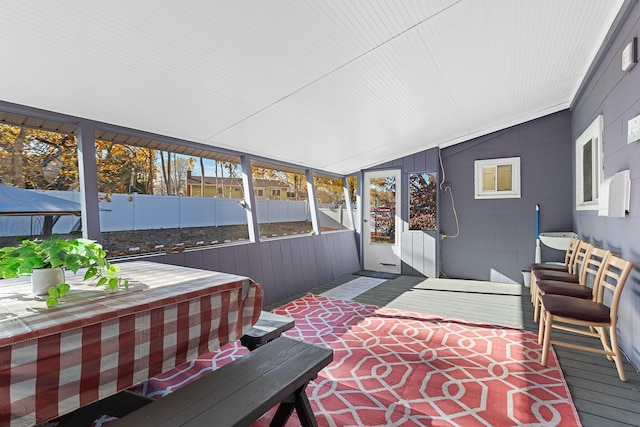 sunroom / solarium with vaulted ceiling