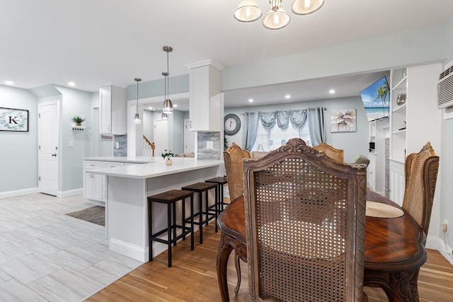 dining space featuring light hardwood / wood-style floors