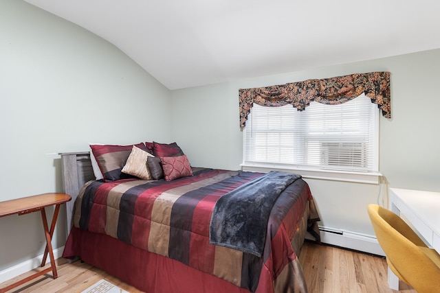 bedroom with light hardwood / wood-style floors, lofted ceiling, and baseboard heating