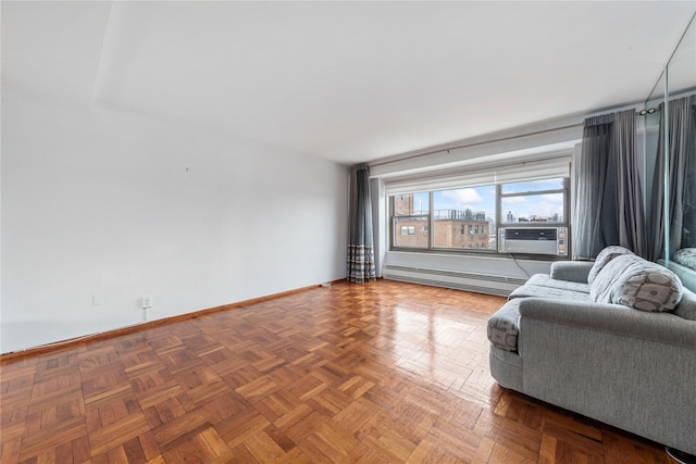 unfurnished living room featuring cooling unit, a baseboard radiator, and parquet flooring