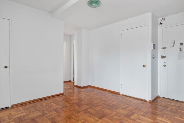 empty room featuring dark parquet floors