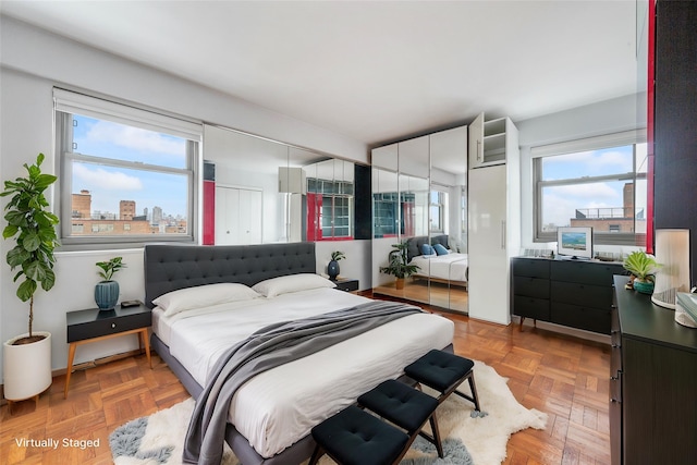 bedroom featuring light parquet floors