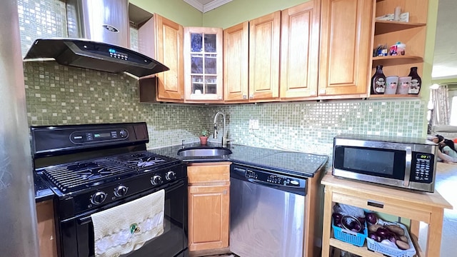 kitchen with backsplash, stainless steel appliances, crown molding, sink, and wall chimney range hood