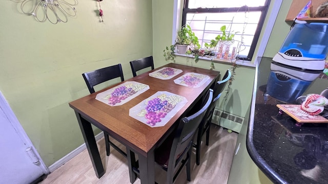 dining room with a baseboard radiator