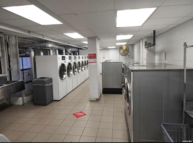 laundry room with light tile patterned floors and washer and dryer