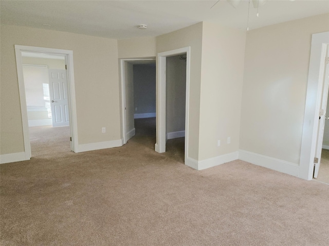 unfurnished bedroom featuring light carpet