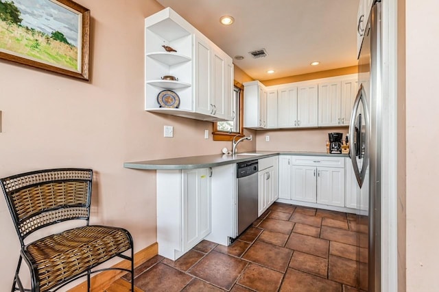 kitchen featuring sink, white cabinetry, and stainless steel appliances