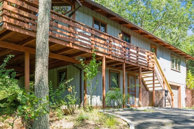 view of property exterior with a deck