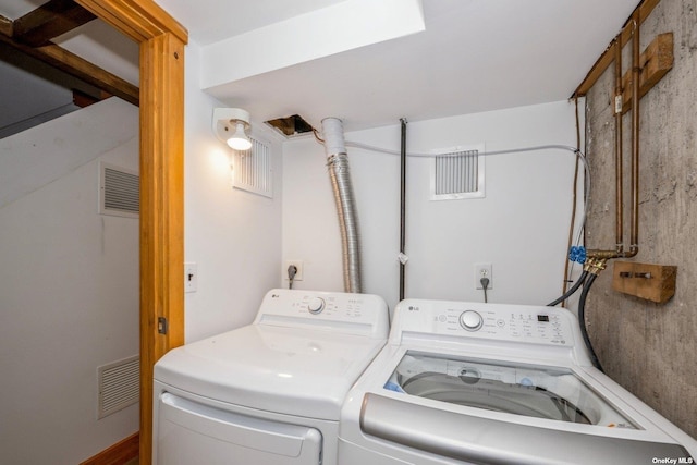 washroom with separate washer and dryer