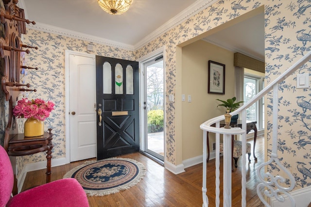 entryway with wood-type flooring and ornamental molding