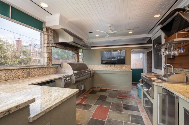 kitchen with ceiling fan, light stone counters, crown molding, fridge, and wood ceiling