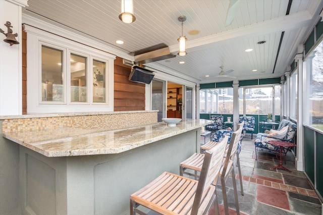 sunroom with wooden ceiling