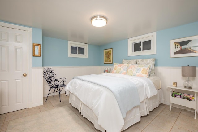 bedroom with light tile patterned flooring