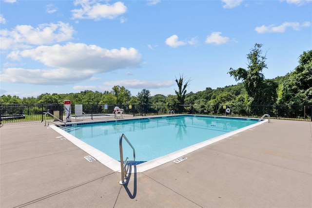 view of swimming pool with a patio area