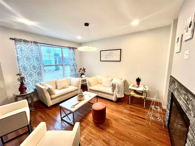 living room with hardwood / wood-style floors and a fireplace