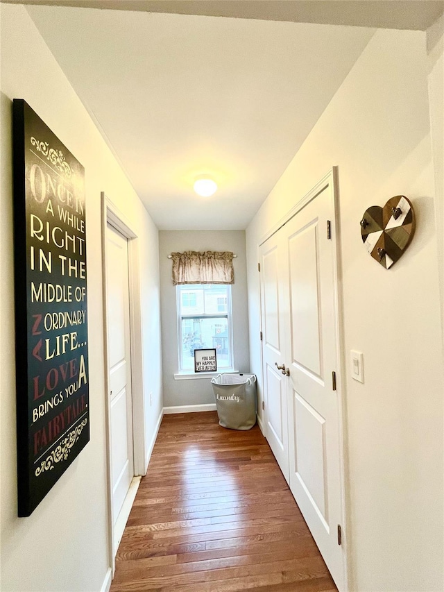 corridor with dark hardwood / wood-style floors