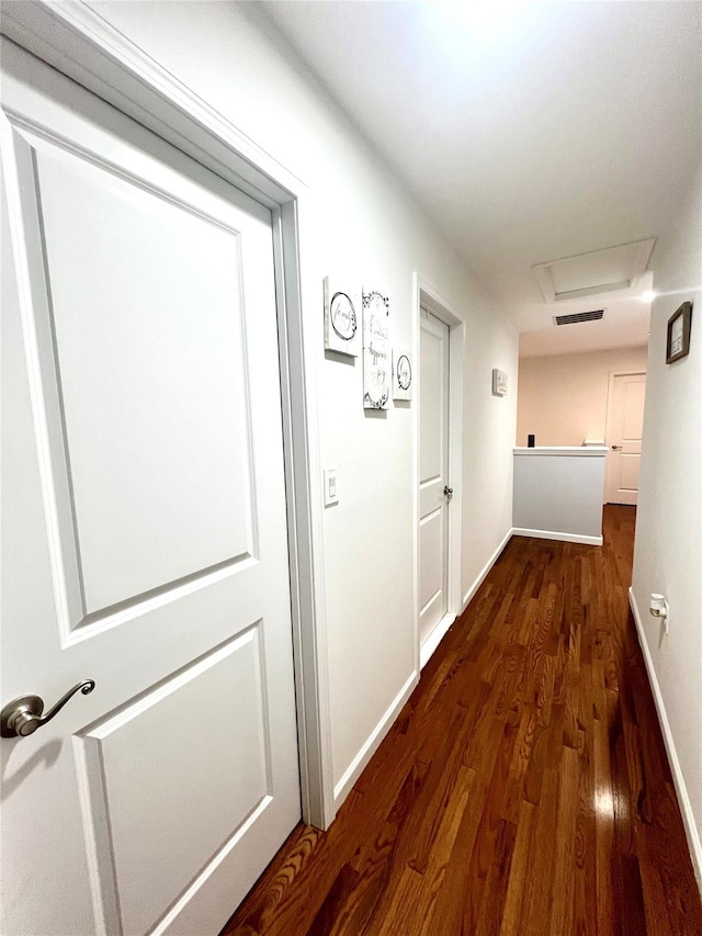 hall with dark wood-type flooring