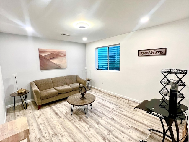 living room with light hardwood / wood-style flooring