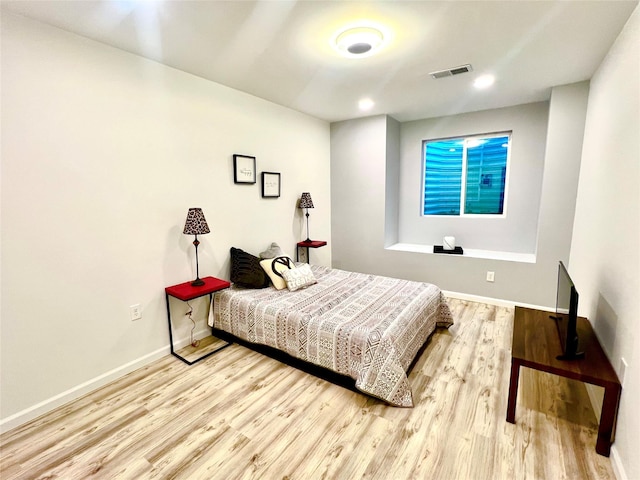 bedroom with light hardwood / wood-style flooring