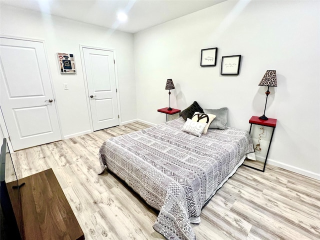 bedroom with light wood-type flooring