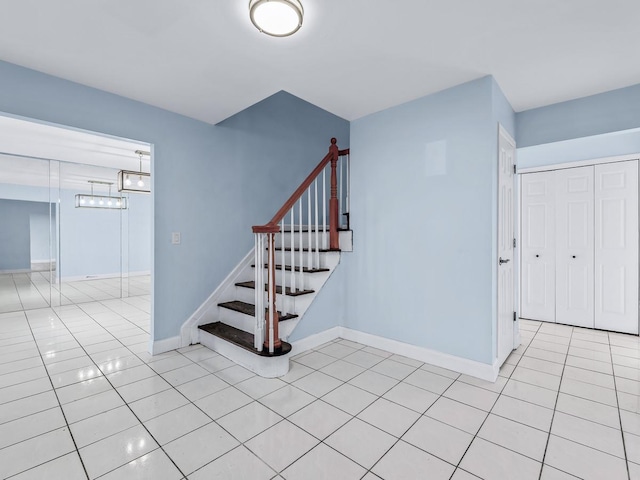 stairway with tile patterned flooring