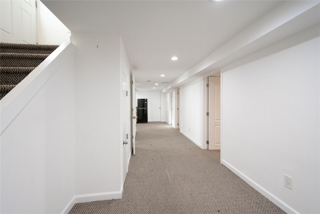 corridor with light colored carpet