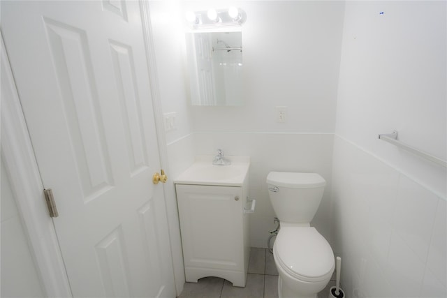 bathroom with tile patterned floors, vanity, and toilet