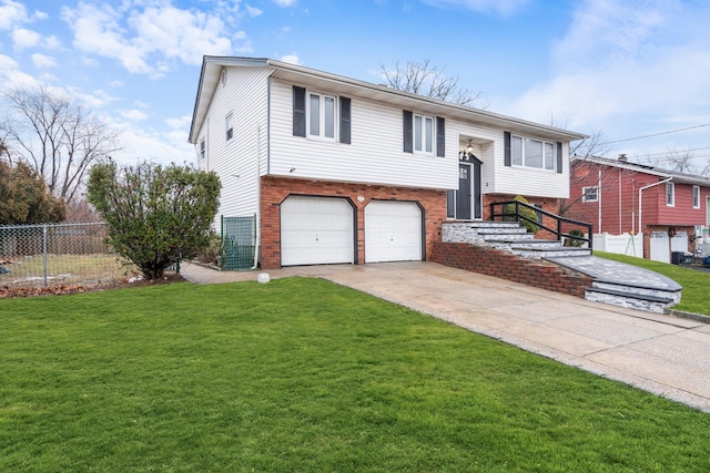 bi-level home with a front lawn and a garage