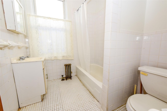 full bathroom featuring shower / tub combo with curtain, tile walls, tile patterned flooring, radiator heating unit, and toilet