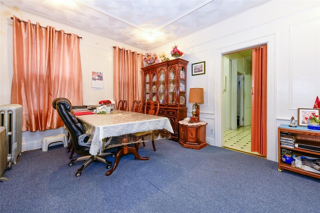 dining area featuring radiator and carpet