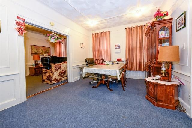 dining space with dark colored carpet