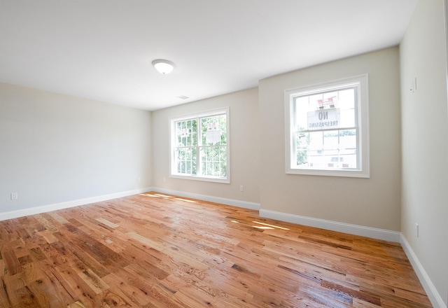 unfurnished room featuring light hardwood / wood-style flooring