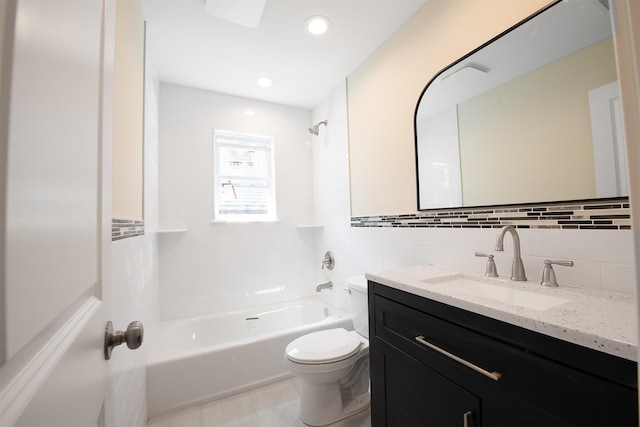 full bathroom featuring tiled shower / bath combo, backsplash, toilet, vanity, and tile walls