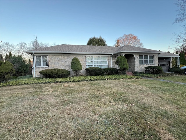 ranch-style house with a front lawn