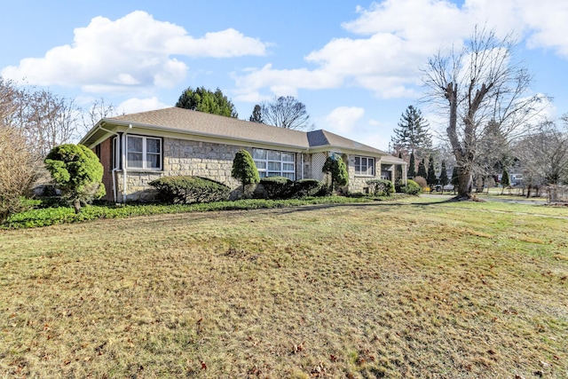 ranch-style home with a front yard