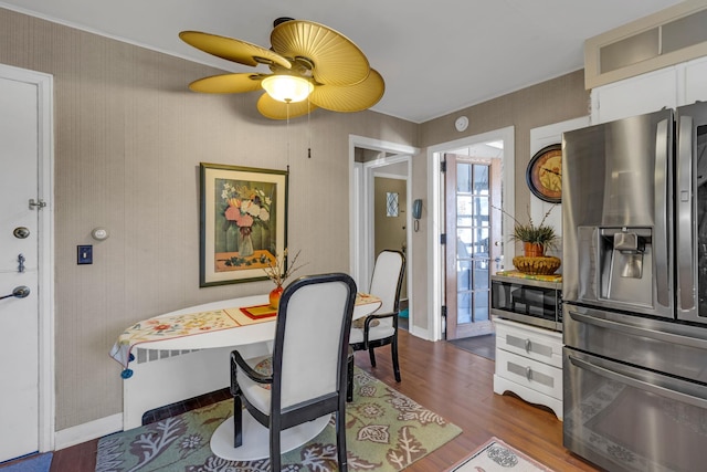 dining room featuring hardwood / wood-style floors and ceiling fan