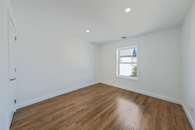 unfurnished room featuring wood-type flooring